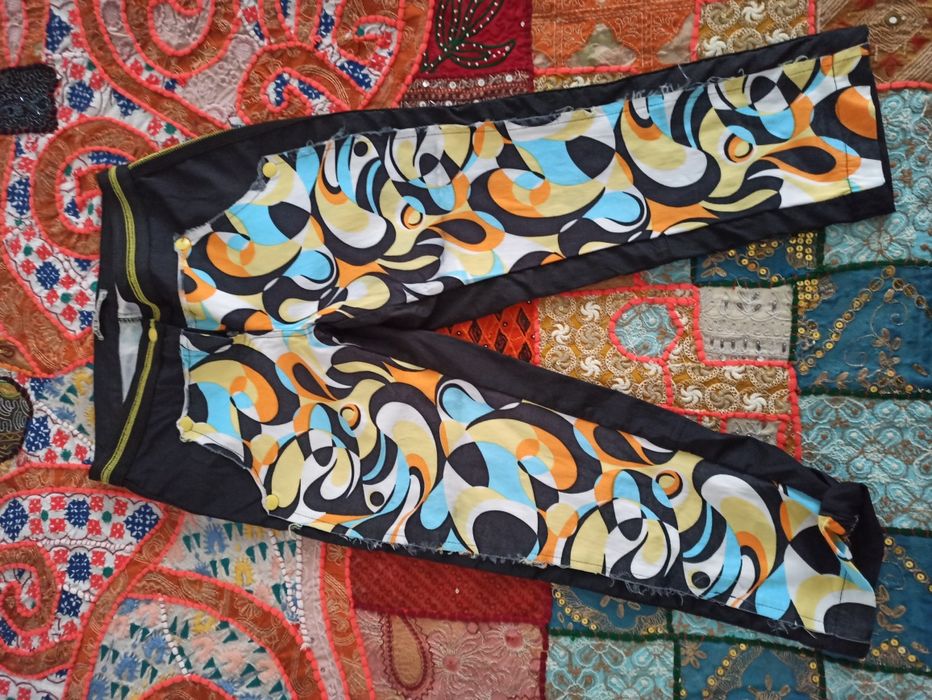 Pantaloni trei sferturi