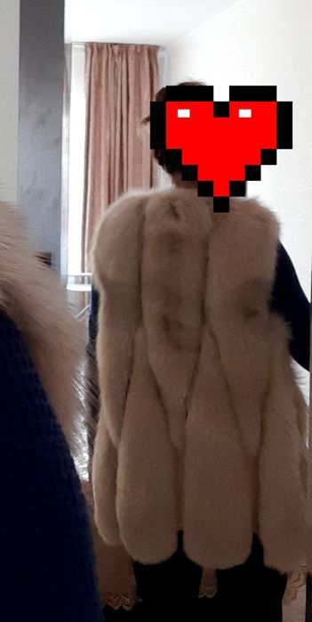 Продам меховую жилетку