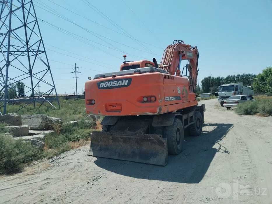 Экскаватор досан 210