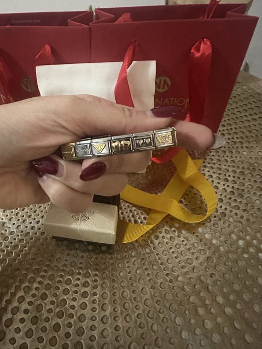 Гривна на Nomination