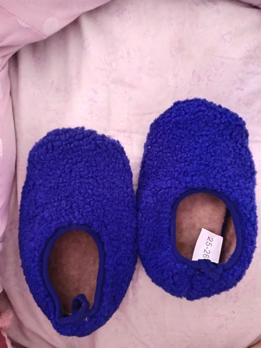 Papucei băieței noi de casa