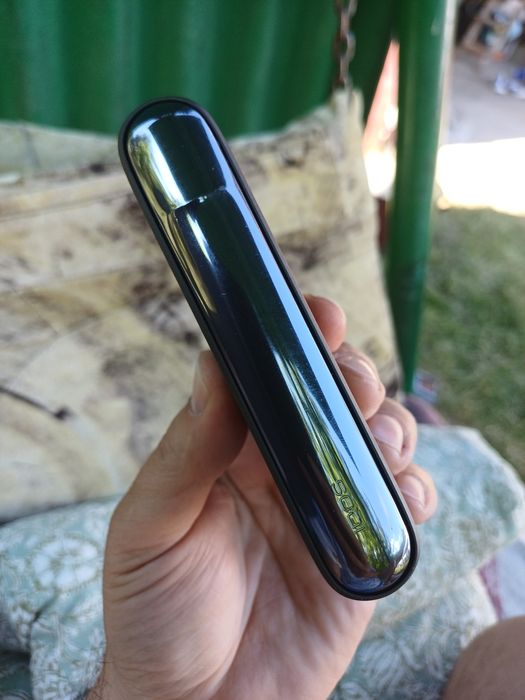 Tigară electronică gama IQOS ILUMA care folosește TEREA).
