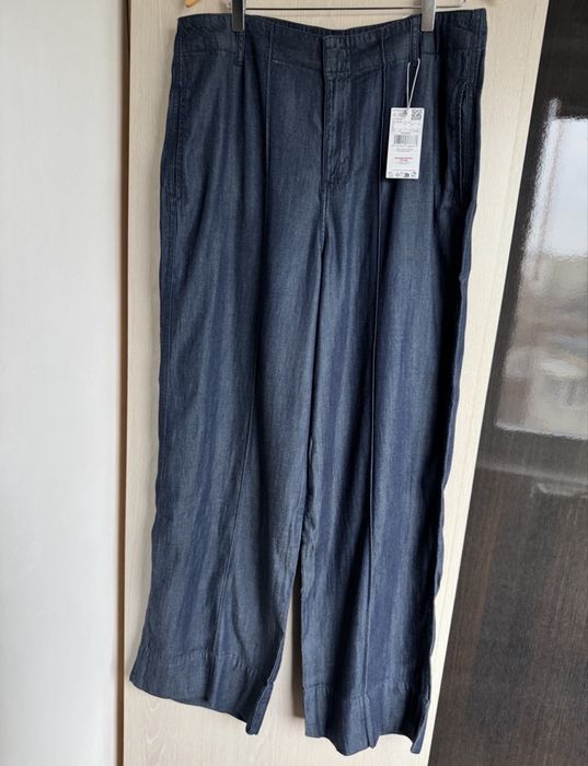 Pantaloni evazati aspect denim XL Mango