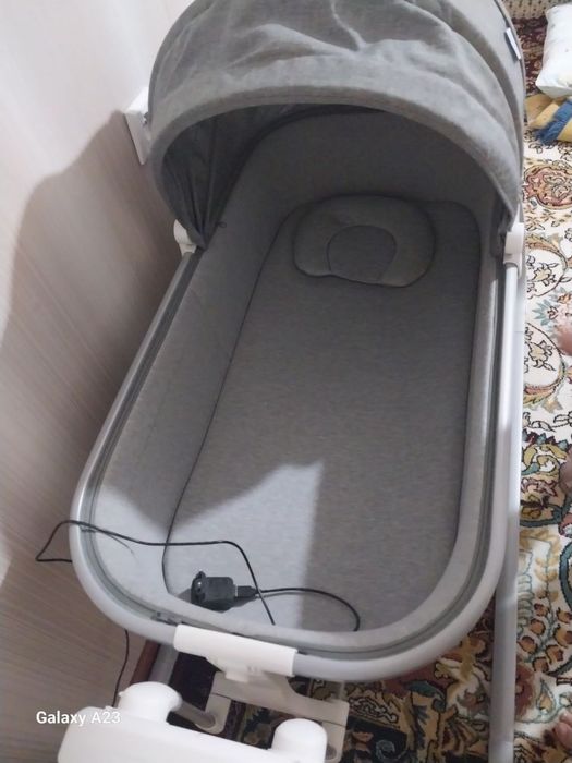 Электрон.бешик (автоматический тебратади, музика чиқаради)