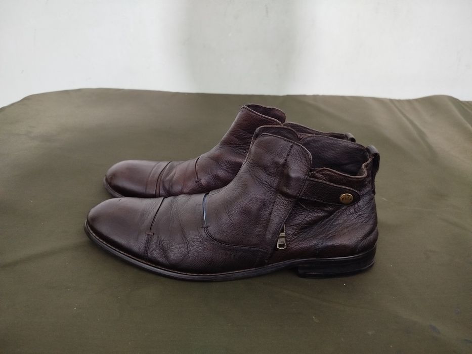 Продам фирменные сапоги.