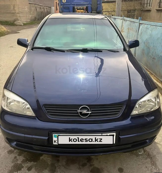 Опель астра машина