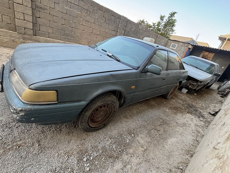 Мазда 626 Переходка запчасть разбор