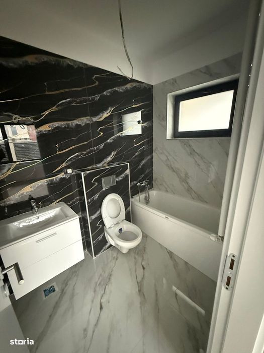 Casă nouă cu 4 camere, curte imprejmuită și centrală pe gaz