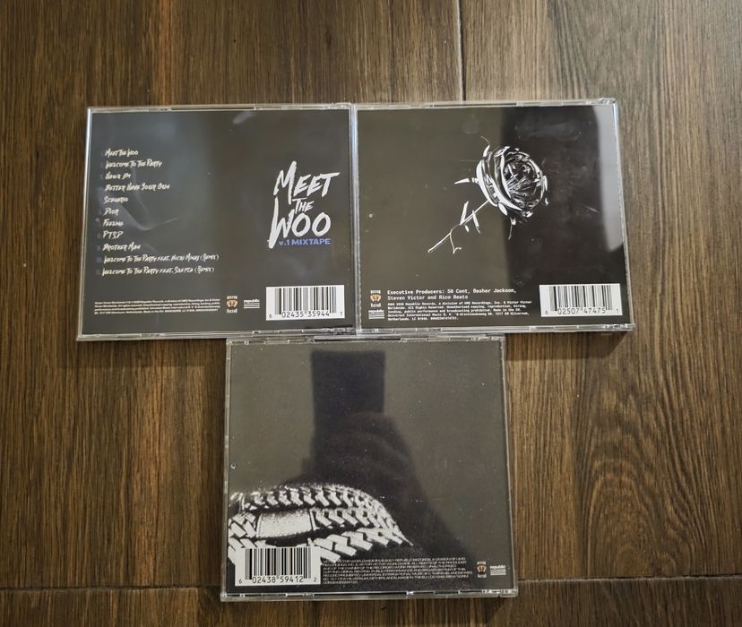 CD дискове на Pop Smoke и 50 cent