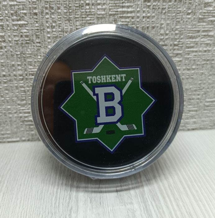 Шайба хоккейная.