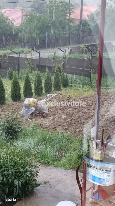 Casă P+M cu 1.558 mp teren, livadă și garaj