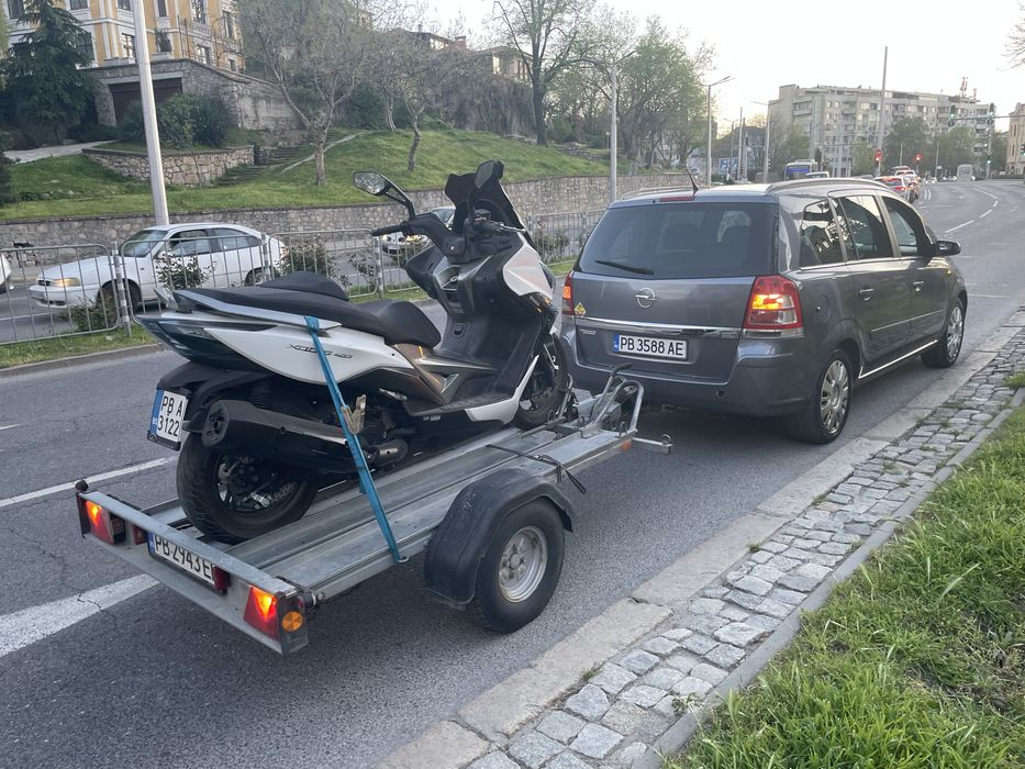 Превоз на мотори и скутери и АТВ и ремарке под наем