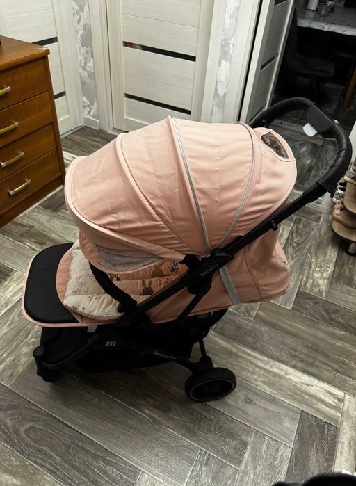 Коляска для девочки розовая