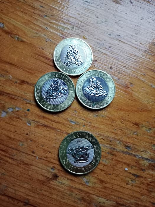 Монеты каждая 100 000 тг