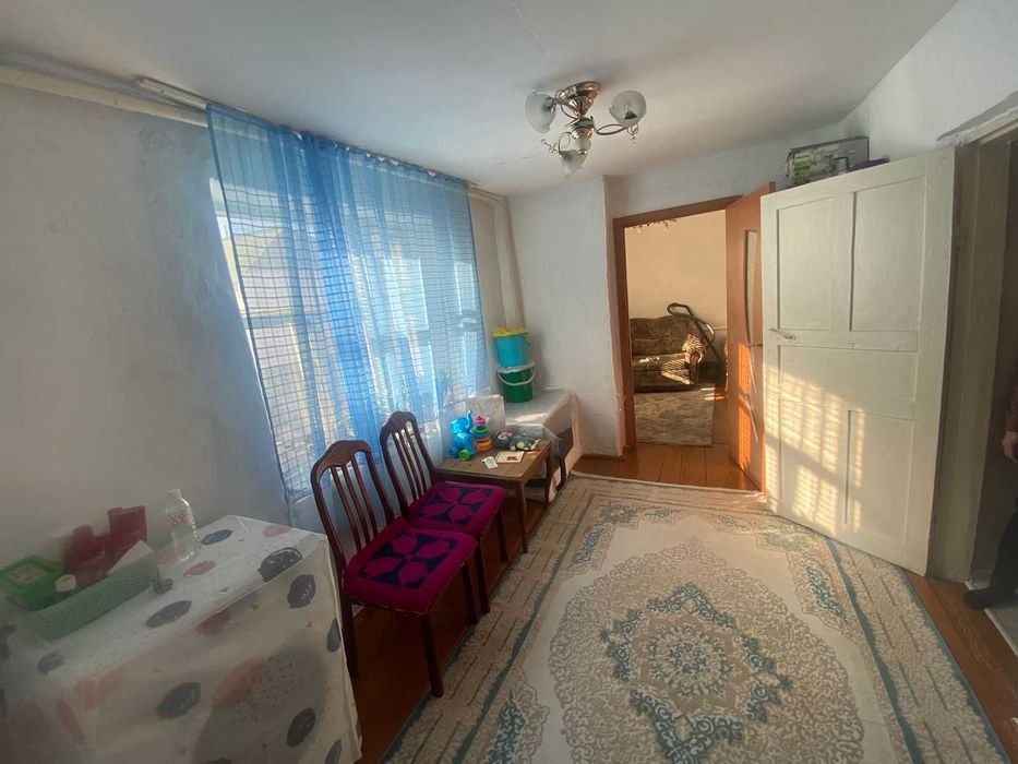 Дом на Бугре, Танат Империя