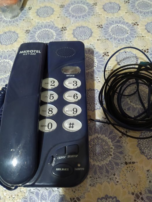 Продам  тюнер  от  спутниковой  антенны и телефон