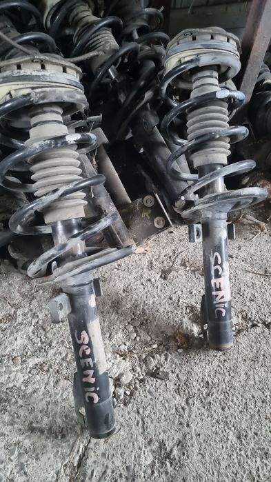 Amortiizor stanga față cu arc si flansa cu rulment renault scenic 2