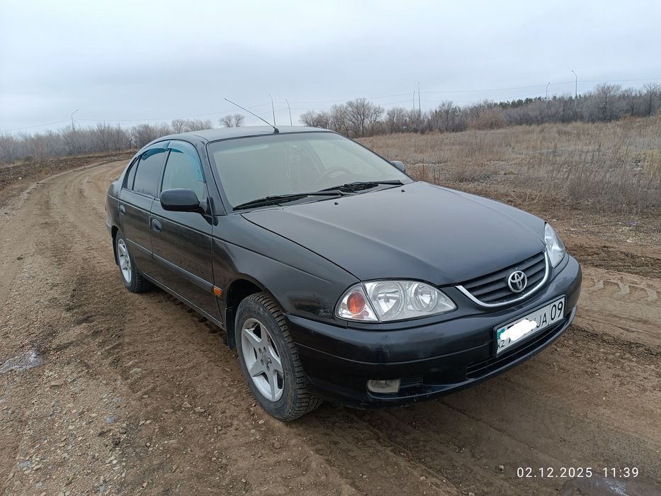 Тойота авенсис .