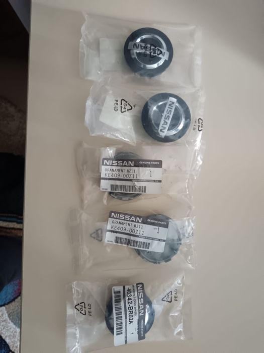 Vand set capace jante aliaj originale Nissan diametru 57 mm noi și originale după cum se poate observ