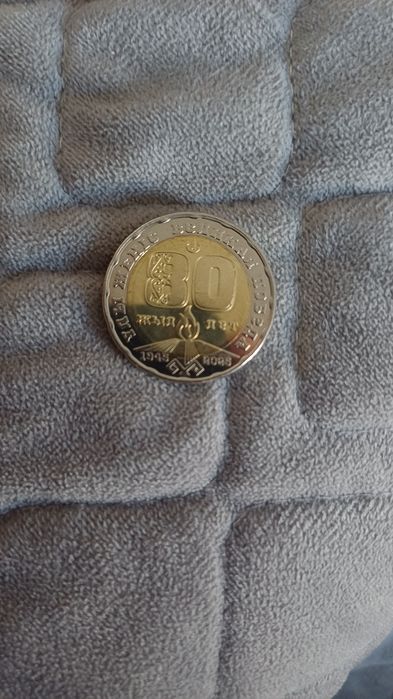 Монета 80лет 200тг