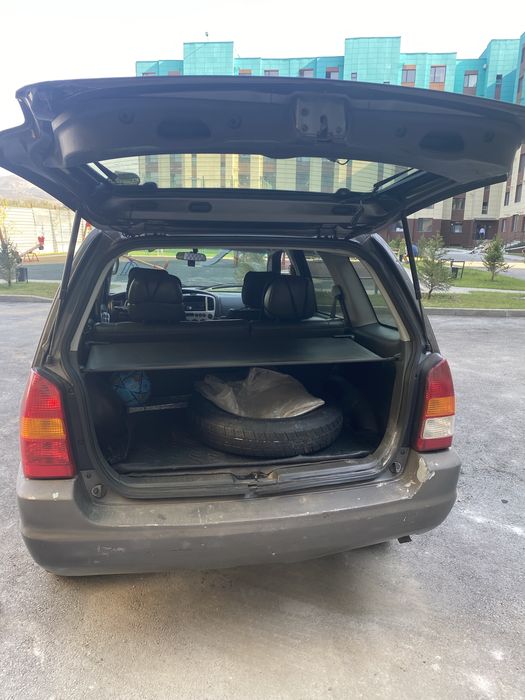 Мазда Трибют