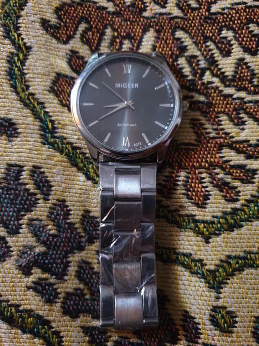 Часы фирмы MIGEER.