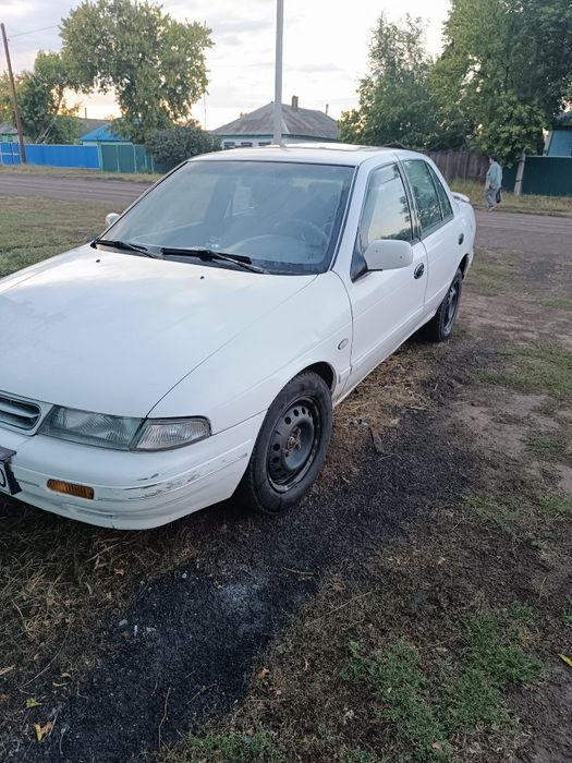 Автомобиль киа сепия