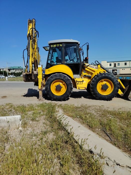 New Holland 115 Pagruzchik