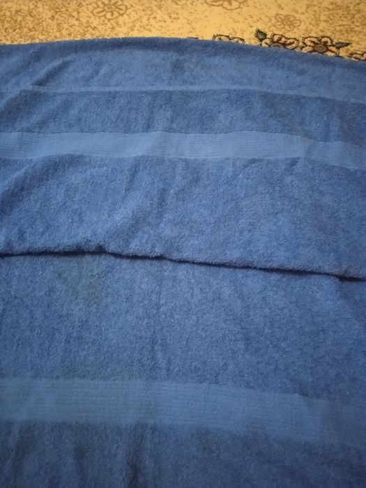 Новое махровое полотенце для сауны