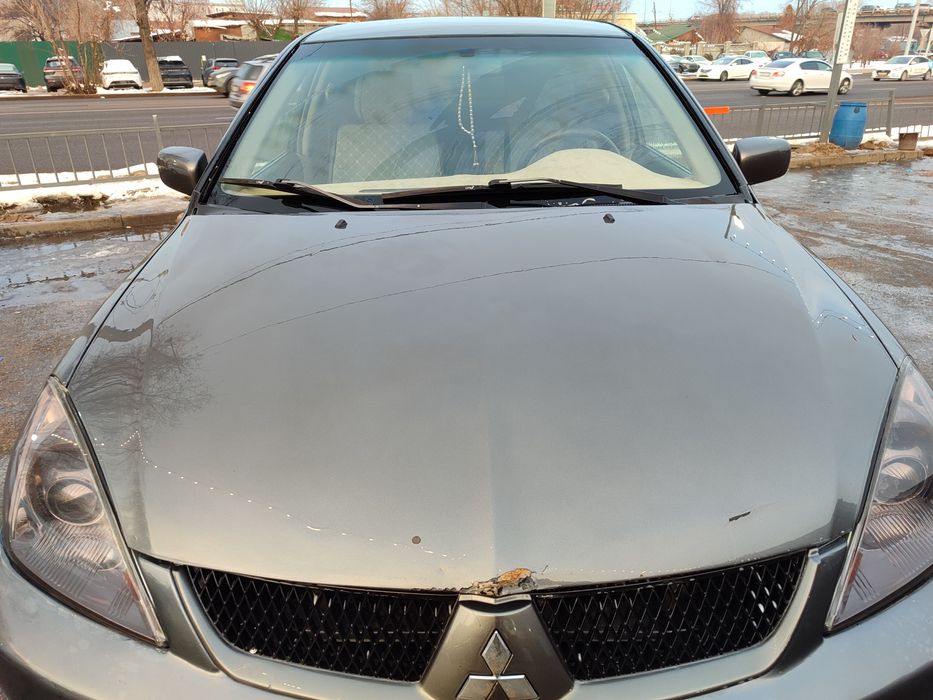 Митсубиси Лансер