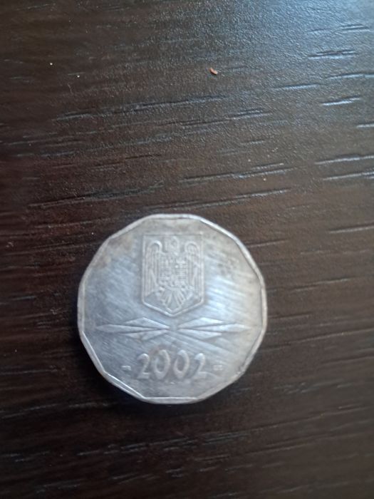 Monedă 5000 lei.
