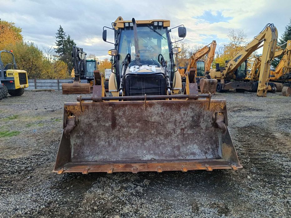 Buldoexcavator CATERPILLAR 428E , cupa multifunctionala
