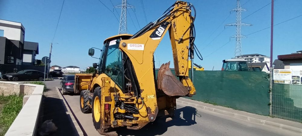 Buldoexcavator Caterpillar 428 F cupa multifuncțional