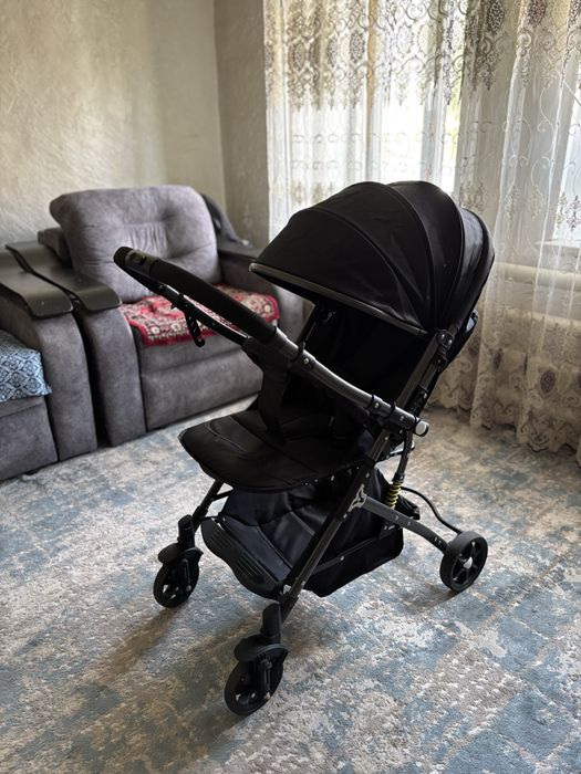 Продам коляску и ходунок