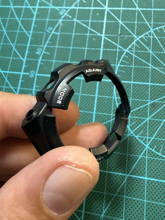 Bezel compatibil Casio MRG-1 – nou, inscriptie alb-argintiu