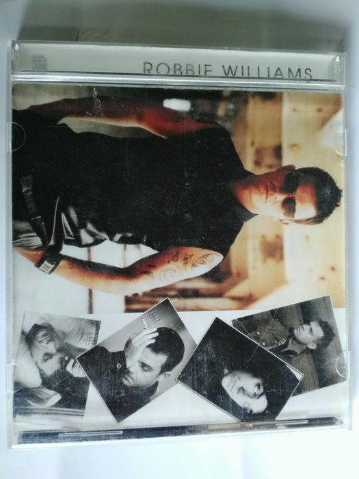 Лицензионный диск robbie williams.Music