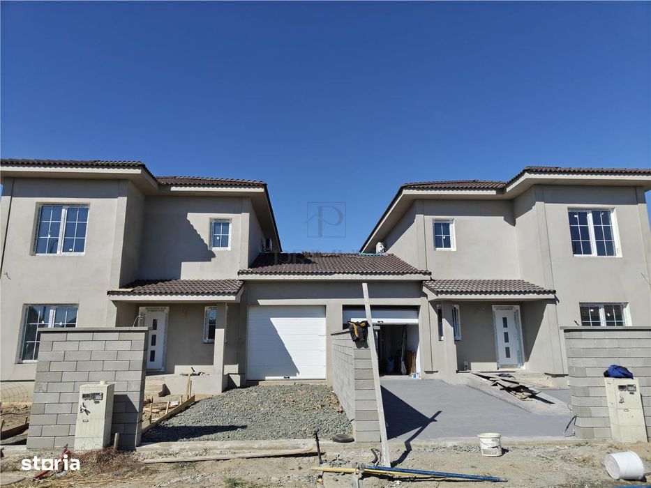 Duplex 5 camere - despartit prin garaj - teren generos