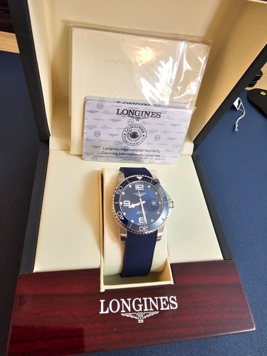 Продам мужские часы LONGINES синнего цвета.