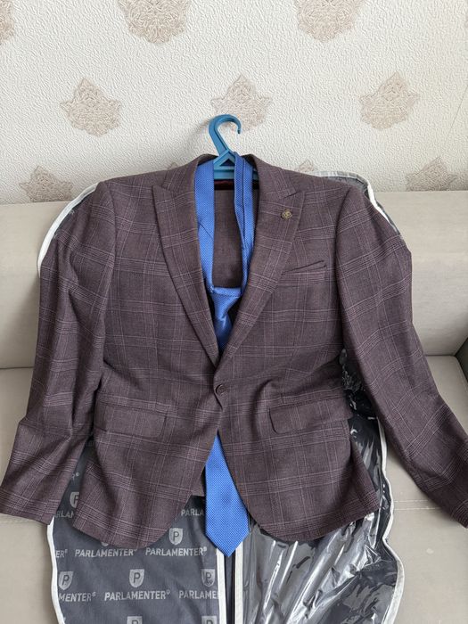 Продам новый костюм б/у