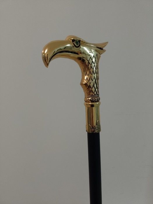 Baston cu mâner cap de vultur din bronz ,piesa cu o lucrătură de o foa