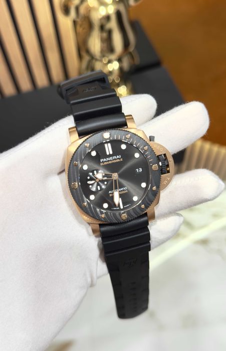panerai luminor submersible gold/black