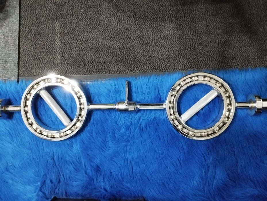 Олимпийски лост с въртящи се рингове