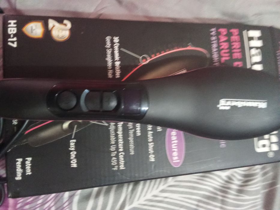 Perie de uscarea și îndreptarea parului