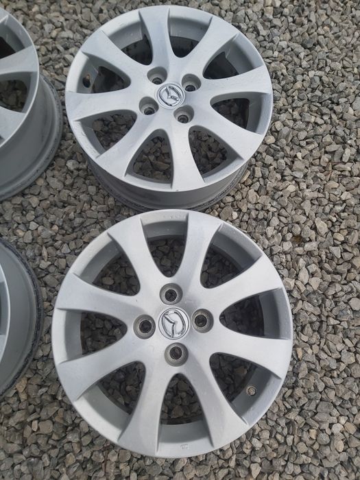 4x100..15.цола.6j ET45..оргинални Mazda