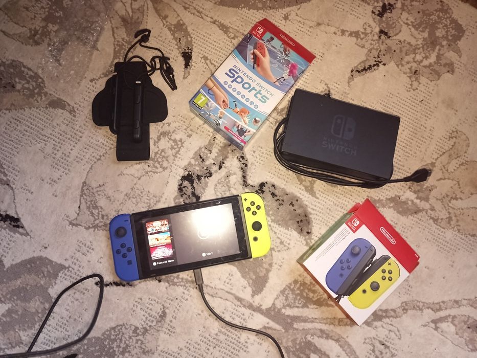 Nintendo switch  + comenzi(2) noi originale și jocuri incluse
