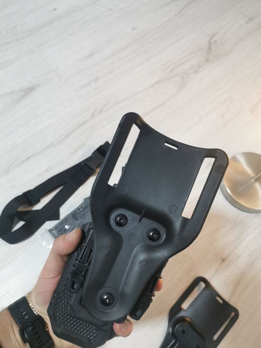 Holster universal cu acțiune rapida universal+platforma.