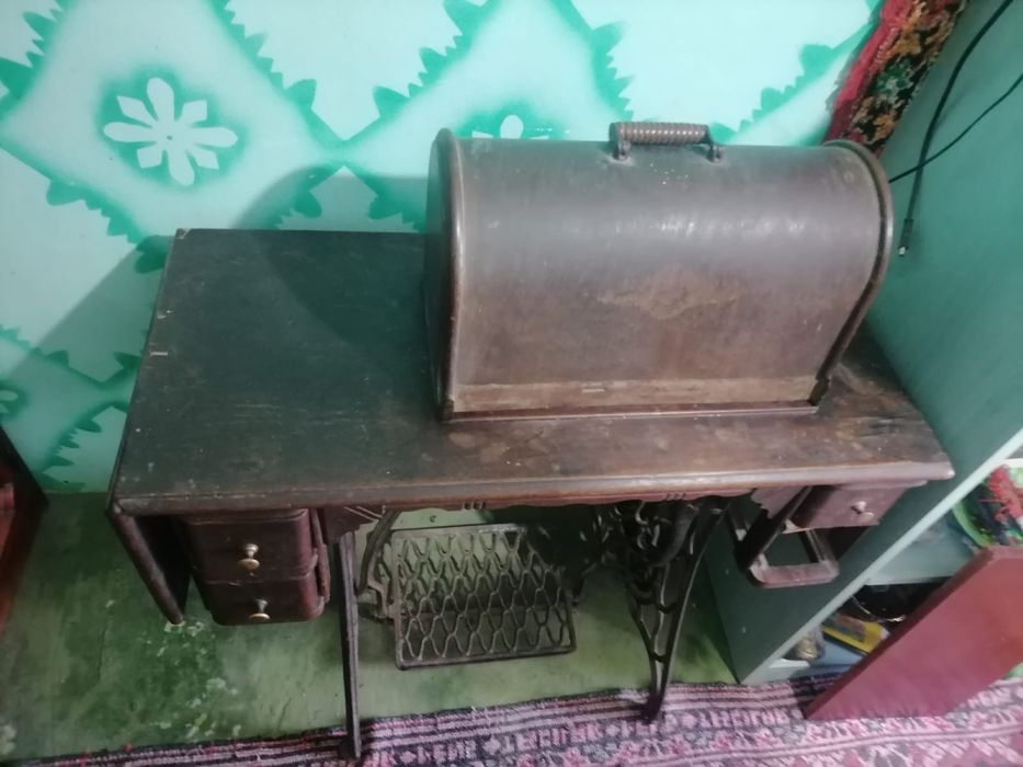 Masina de custut singer