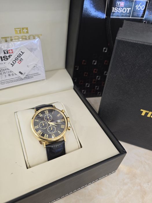 Продам золотые часы Tissot