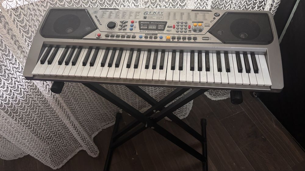 Orga electronica elSales ELS-001 cu 61 de clape, 100 de ritmuri, 100 de tonuri, 10 melodii demo, argintiu(mai las din pret!)