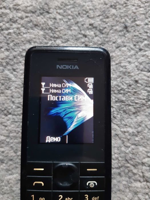 Мобилен телефон NOKIA 107, със зарядно у-во и слушалки